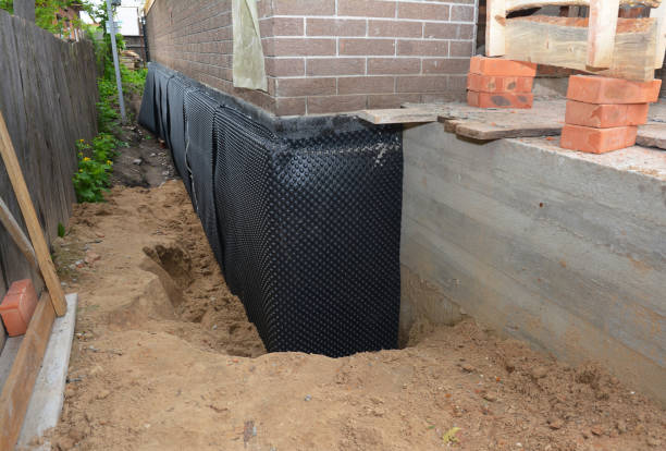 Happy homeowners after waterproofing job in Robertsdale